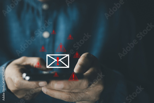 Businessman receives suspicious email alert that may be spam email, warning email icons, malware, data breach, scam message, spam risk, and online fraud protection...
