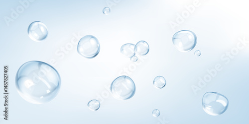 Transparent drops isolated on light blue background. Clear bubbles design elements.