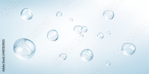 Transparent drops isolated on light blue background. Clear bubbles design elements.