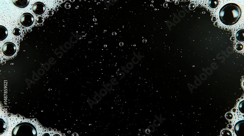 Bubbles with foam, and black background.