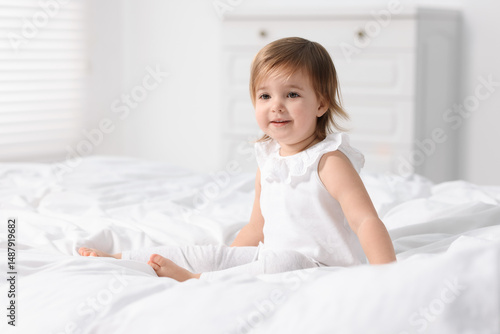 Wallpaper Mural Cute little baby girl on bed at home Torontodigital.ca