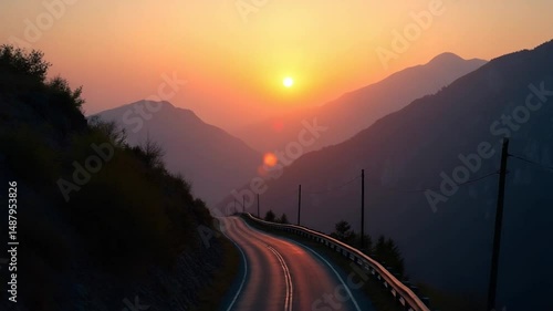 An aerial view of a road in the mountains. beautiful sunset