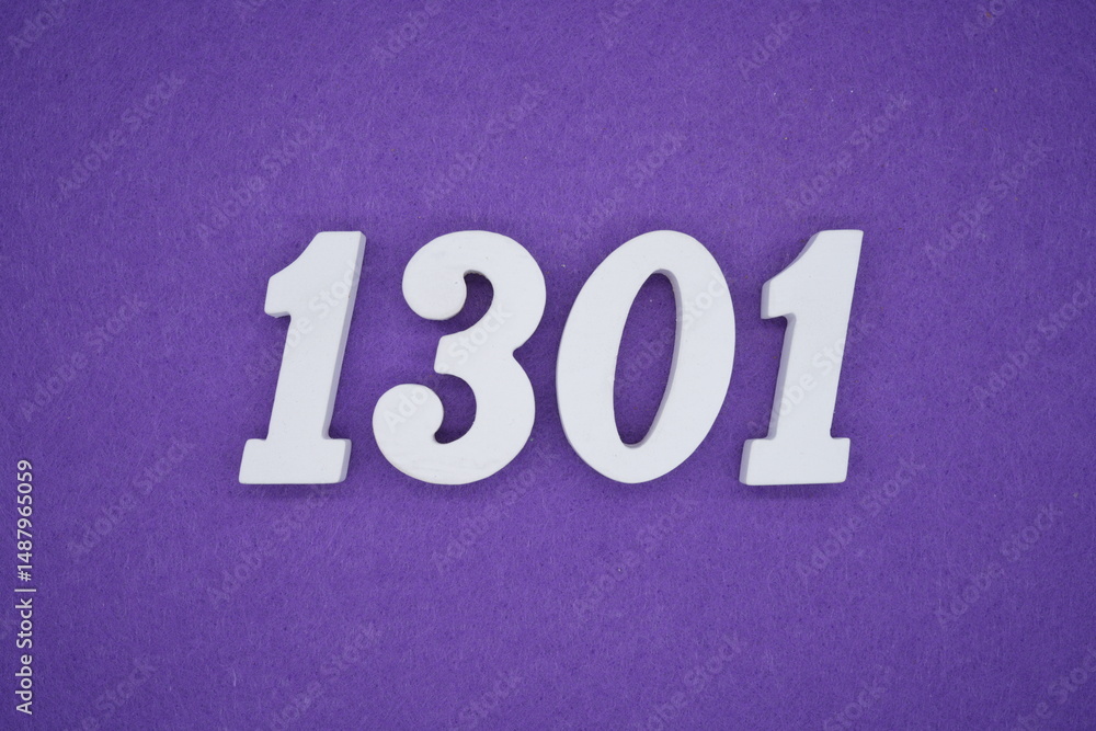 The numbers are made of white painted wood placed on a purple paper background. The numbers are made of white painted wood placed on a purple paper background.