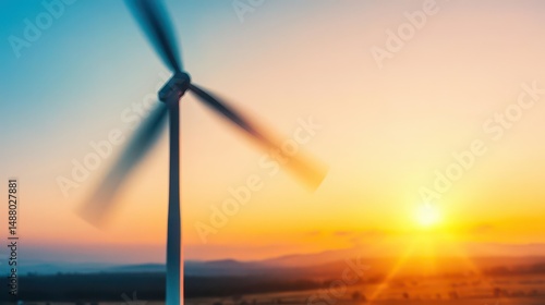 Majestic Wind Turbine Silhouetted Against a Vibrant Sunset Sky with Warm Hues Creating a Peaceful Atmosphere in a Sustainable Energy Landscape