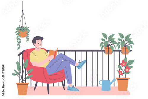 Relaxed Young Man Reading Book on Urban Balcony with Plants
