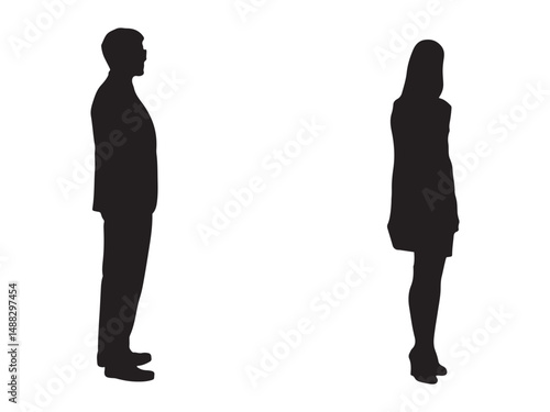 Silhouette of a man and woman standing apart.