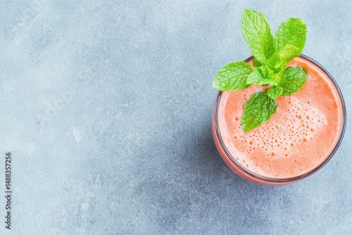  Refreshing Elixir with Mint: An overhead view captures a refreshing elixir in a glass. Freshly muddled mint leaves adorn the surface, tantalizing taste buds and offering a taste of natural goodness.