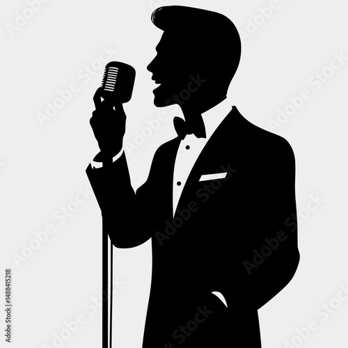 Silhouette of a male singer in a tuxedo performing passionately