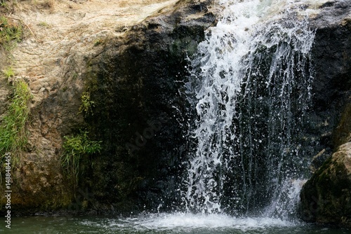 Pokeno Waterfall cascading in summer, North Island New Zealand