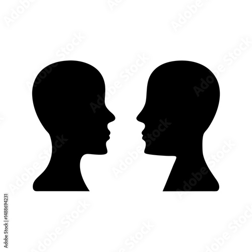 Silhouette of two faces looking at each other, concept of communication