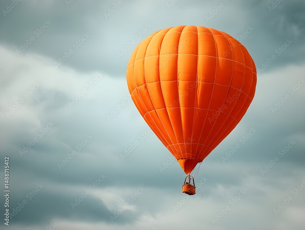 Fototapeta premium Embark On Skyward Adventures With An Orange Hot Air Balloon Against A Dramatic Cloudy Sky