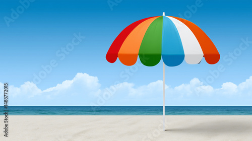 Obraz na płótnie Colorful beach umbrella on a sandy shore with blue sky w salonie