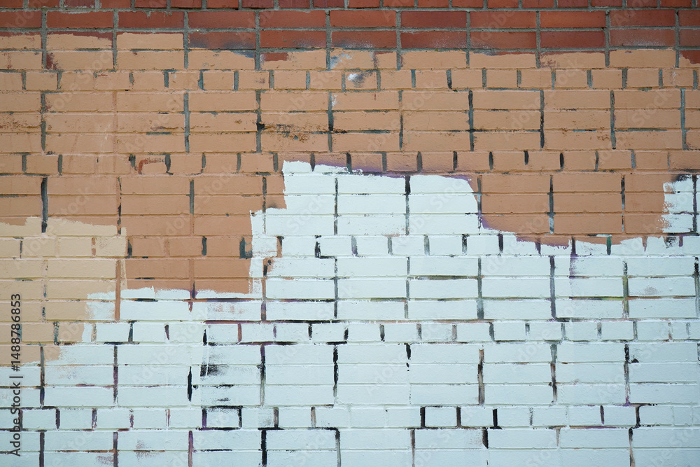 Fototapeta premium Brick wall painted with stripes of paint.