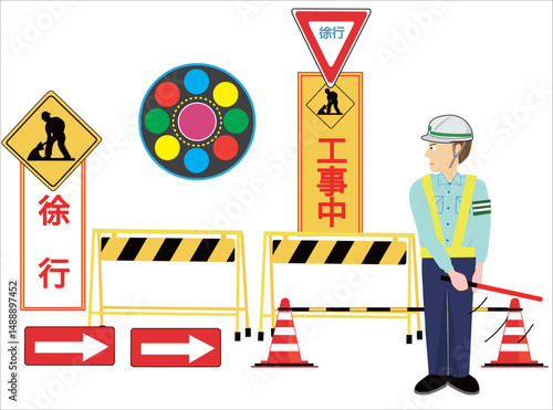 工事現場で車を誘導している交通誘導員。