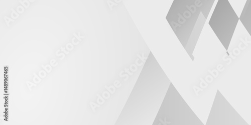 Modern abstract background with geometric shapes. A clean, simple design is achieved with gray and white angled planes creating a subtle yet dynamic texture.