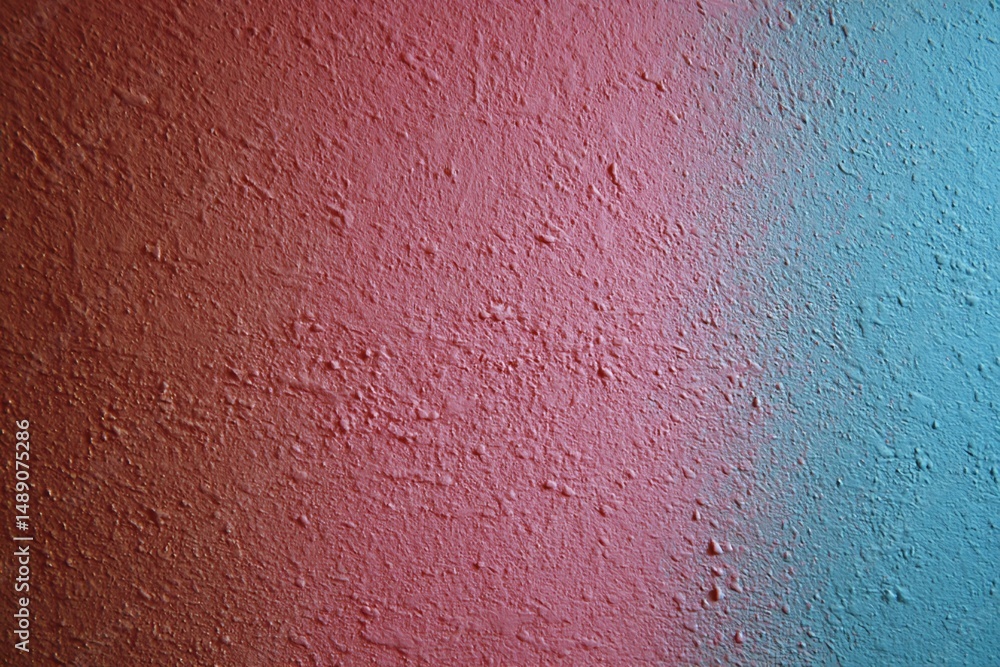 Obraz premium Reddish-Pink and Teal-Blue Textured Wall Surface
