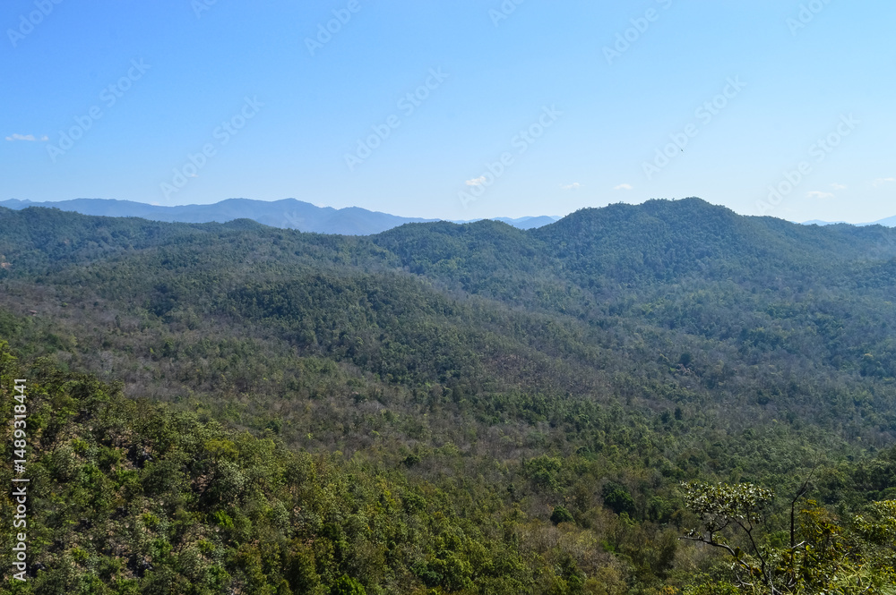 Fototapeta premium Distant Mountains and Forest with Trees and Sky in Northern Thailand.