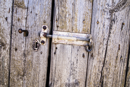 Weathered timber door with hasp
