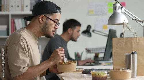 Man eating healthy meal while working, Businessman having a lunch break at the office