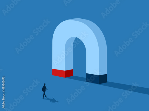 businessmen attracted by magnet