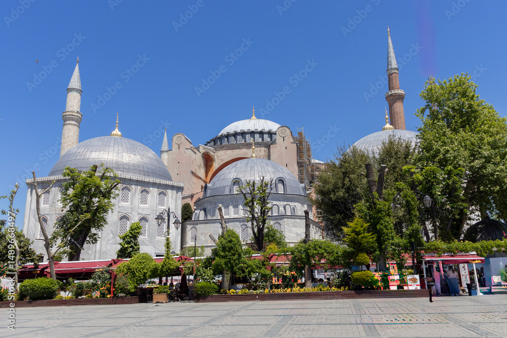 Obraz premium Images of historical Istanbul and the Bosphorus. The photograph includes tourists, ferries and flying birds. Hagia Sophia. Sultan Ahmet Mosque. Suleymaniye. Eminonu. Sirkeci. 