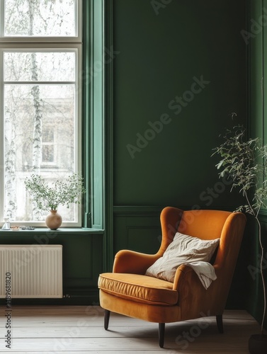 An orange velvet chair beside a window in a room