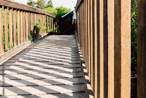 stairs leading to the beach, with slanting shadows