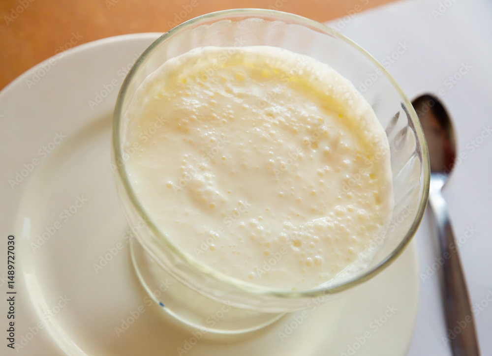Appetizing white mousse served in glass Appetizing white mousse served in glass