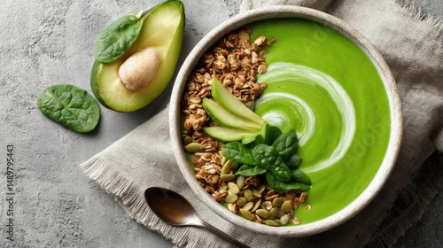 Healthy smoothie bowl with granola and creamy yogurt concept. Healthy green smoothie bowl topped with granola and fruits.