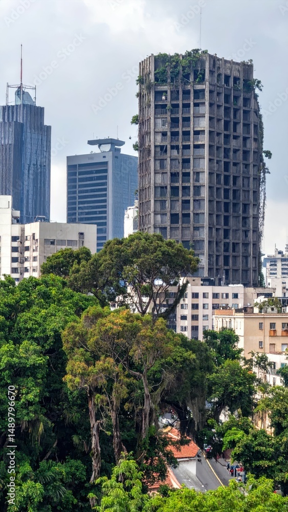 Fototapeta premium Urban Skyline with Nature Reclaiming Abandoned Buildings and Trees