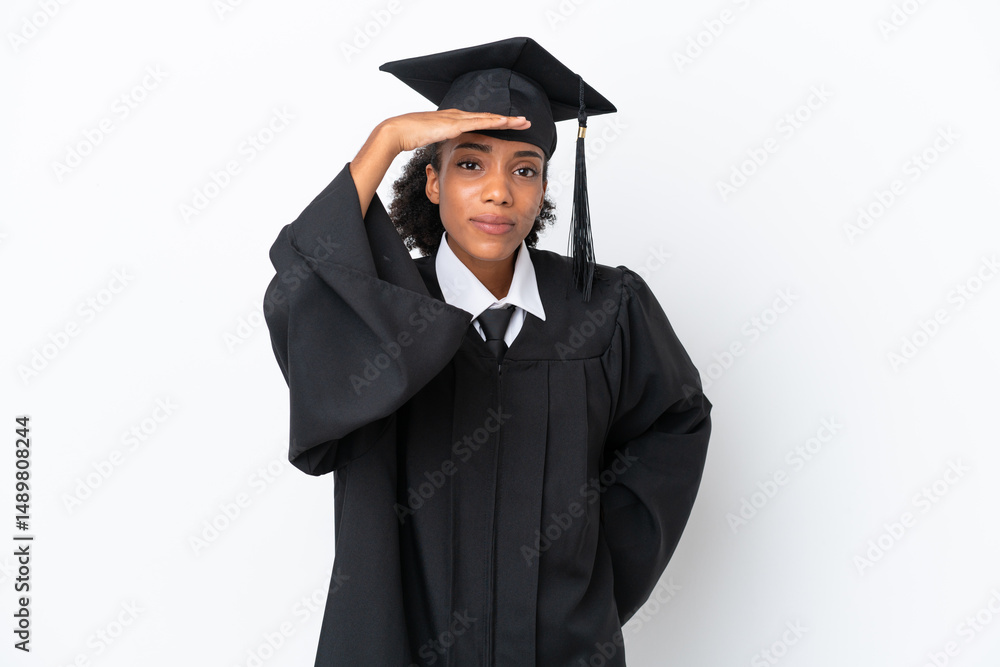 Young university graduate African American woman isolated on white background looking far away with hand to look something Young university graduate African American woman isolated on white background looking far away with hand to look something