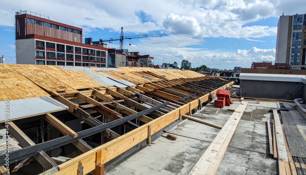 Fototapeta premium Rooftop Undergoing Transformation with Scaffolding and Construction Elements