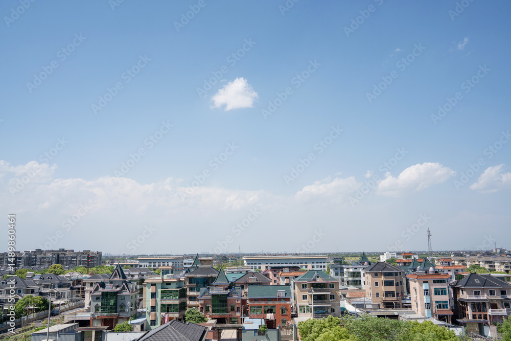 blue sky over small town blue sky over small town