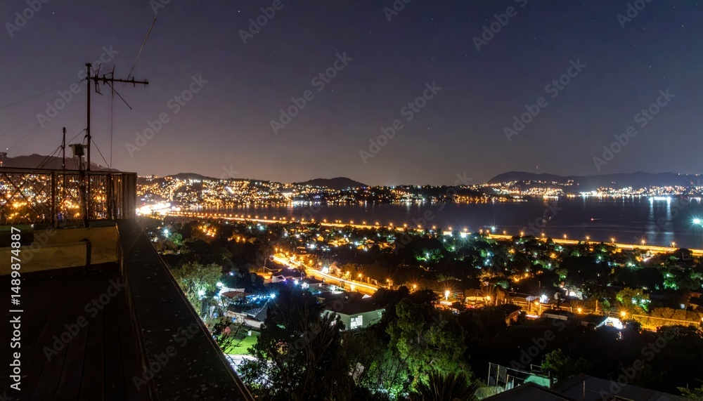 Fototapeta premium Rooftop View of City Lights and Streetlights at Nighttime
