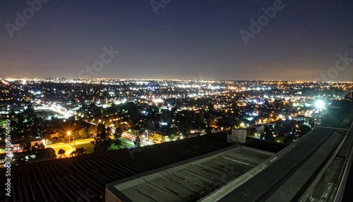 Wallpaper Mural Rooftop View of Cityscape at Night with Streetlights Illuminating Below Torontodigital.ca