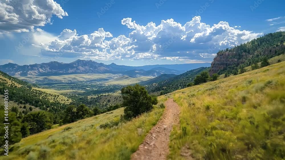 Scenic Mountain Valley Trail with Blue Sky and Puffy Clouds Grassy Hills and Distant Peaks Under Bright Sunlight Impressionist Render Scenic Mountain Valley Trail with Blue Sky and Puffy Clouds Grassy Hills and Distant Peaks Under Bright Sunlight Impressionist Render