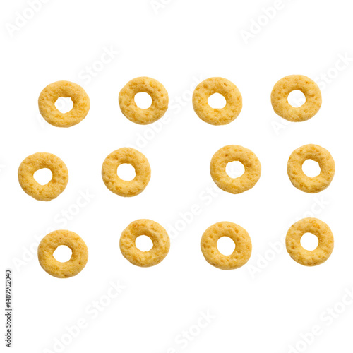 Collection of golden cereal rings arranged in a grid simple breakfast food elements for healthy eating concepts isolated on white isol