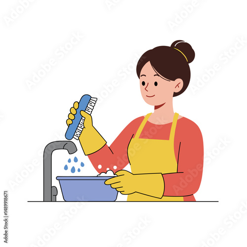 Woman cleaning a bowl with a brush and smiling while washing dishes in a kitchen with copy space