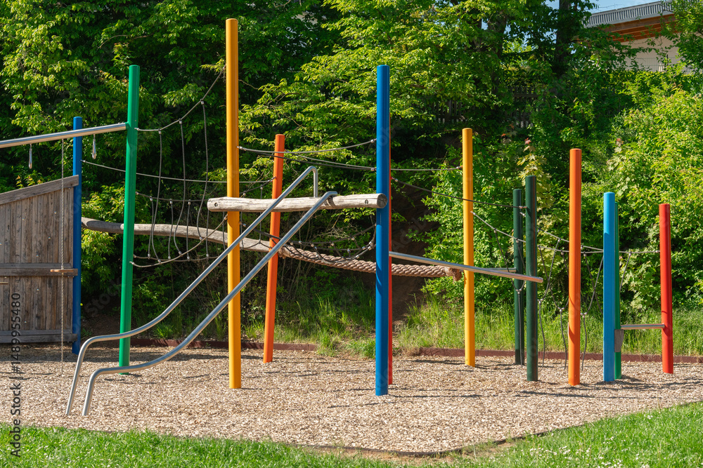 Fototapeta premium Colorful Playground with Slide in a Sunny Park