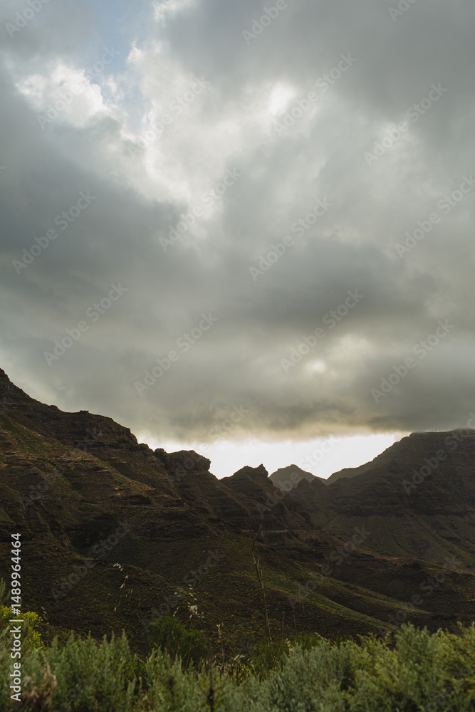 Fototapeta premium Dramatic Mountain Landscape Under Cloudy Sky