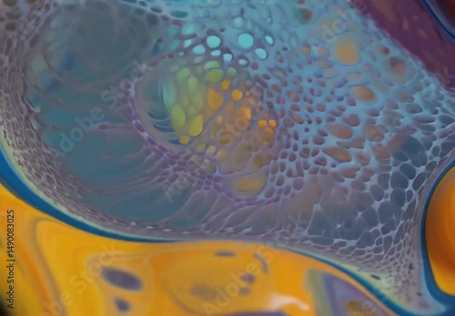 Abstract artwork showcasing a fluid blend of vibrant, colorful paints with intricate textures and shapes.