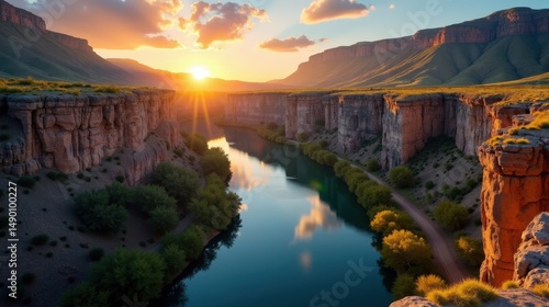 Golden sunrise bathes Guadalupe River Gorge in warm light, seen from a panoramic perspective.