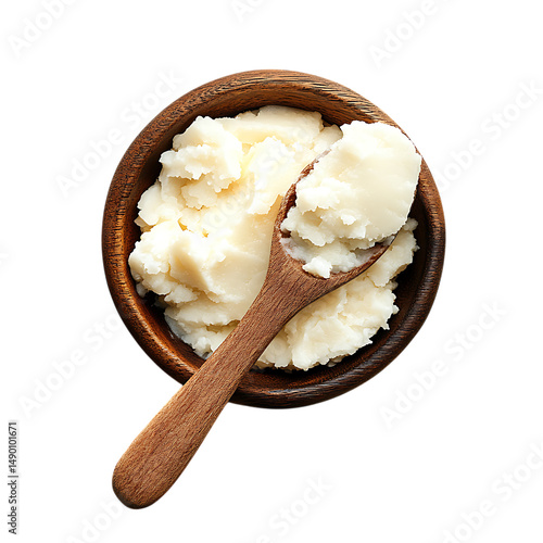 Shea butter in wooden bowl with wooden spoon