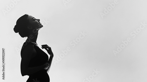 Side profile of woman in monochrome tones, dramatic lighting