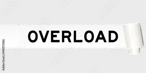 Ripped gray paper background that have word overload under torn part