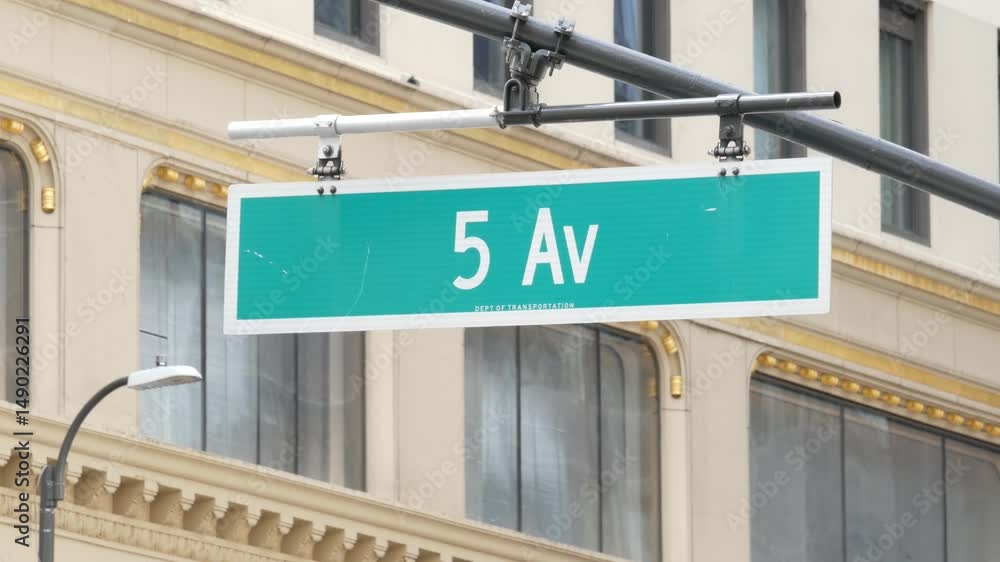 Fifth avenue 5 ave road sign, Manhattan midtown architecture, New York City 5th av street corner. Green traffic crossroad signage, USA. Window of yellow building.