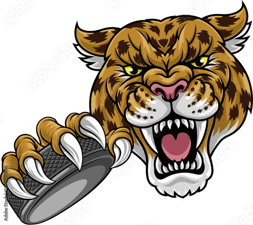A jaguar, panther, leopard or cheetah wildcat spotted cat hockey sports team mascot holding an ice hockey puck