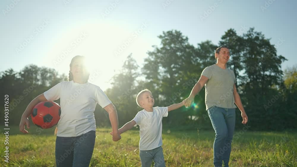 Happy family having fun in park with red ball. Children holding hand enjoying playful time outdoors. Family bonding through fun games in nature. Smiling kids and parents play with ball in scenic park Happy family having fun in park with red ball. Children holding hand enjoying playful time outdoors. Family bonding through fun games in nature. Smiling kids and parents play with ball in scenic park