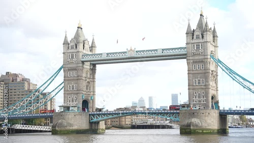 Still Shot of Tower Bridge with Red Buses Crossing in London
