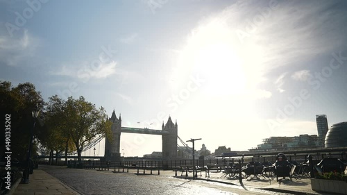 Tilt-Down Shot of Tower Bridge with Bright Midday Sunlight and Empty Cobblestone Path